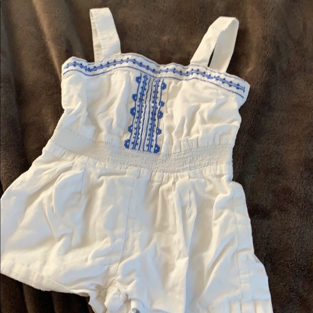 Adorable white linen onesie with blue embroidery